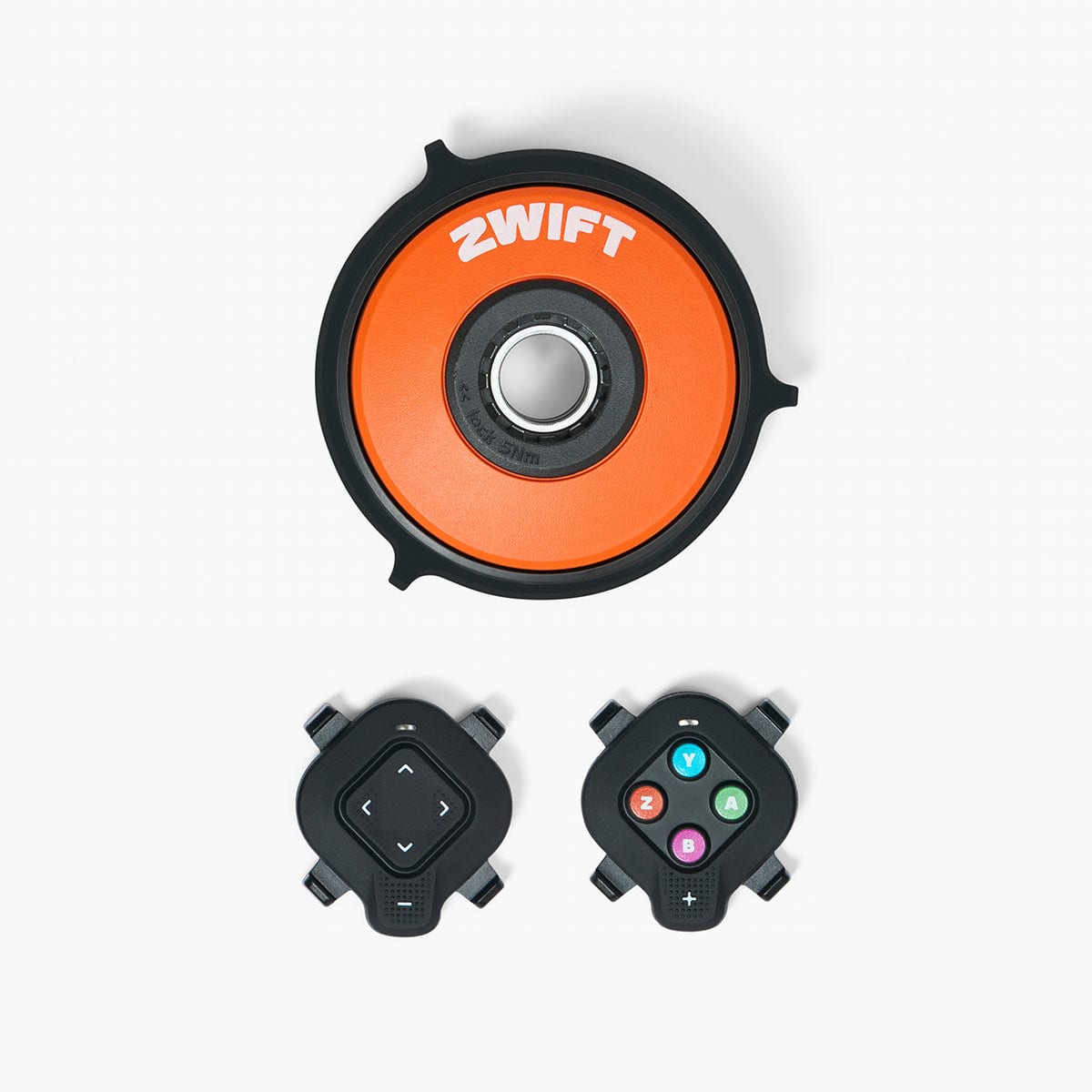 Zwift Cog and Click Upgrade Kit — product box and contents showing the single 14-tooth cog, the Zwift Click handlebar controller, and the upgrade documentation