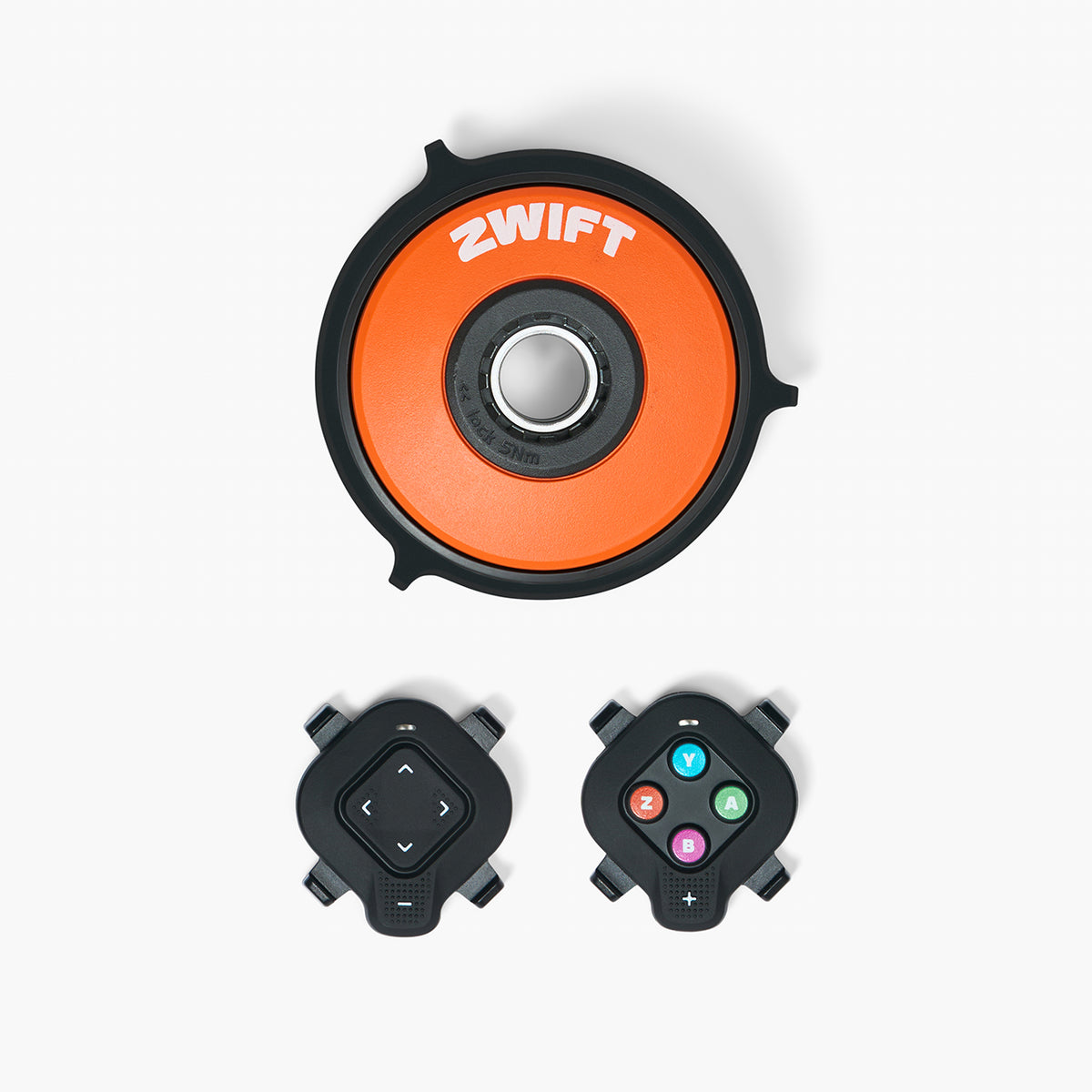 Zwift Cog and Click Upgrade Kit — product box and contents showing the single 14-tooth cog, the Zwift Click handlebar controller, and the upgrade documentation