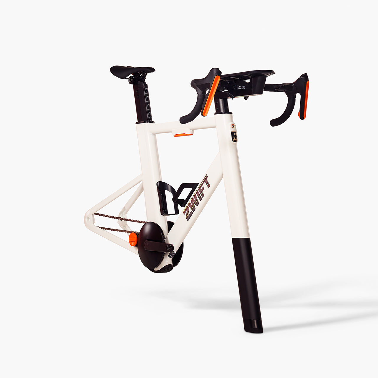 Zwift Ride Smart Frame mounted on a Zwift-Ready smart trainer, showing the always-ready smart-bike configuration with built-in handlebar controllers, single-chainring drivetrain, and Zwift Cog v2 single-cog rear end